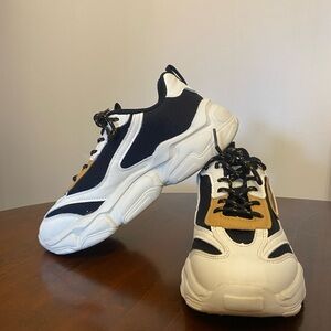 Stylish Black and White Sneakers with Tan Accents